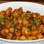 Gobi Manchurian crisp cauliflower bites in a white casserole