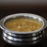 Parippu payasam served in a steel bowl.