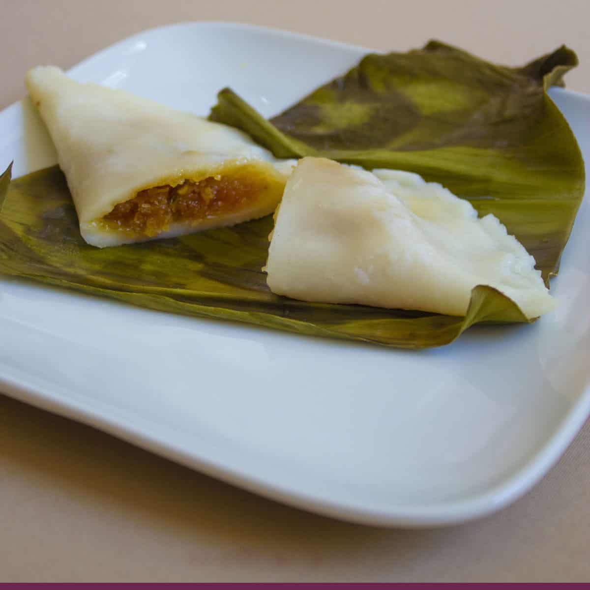 vazha ela ada on a white plate steamed in a banana leaf.