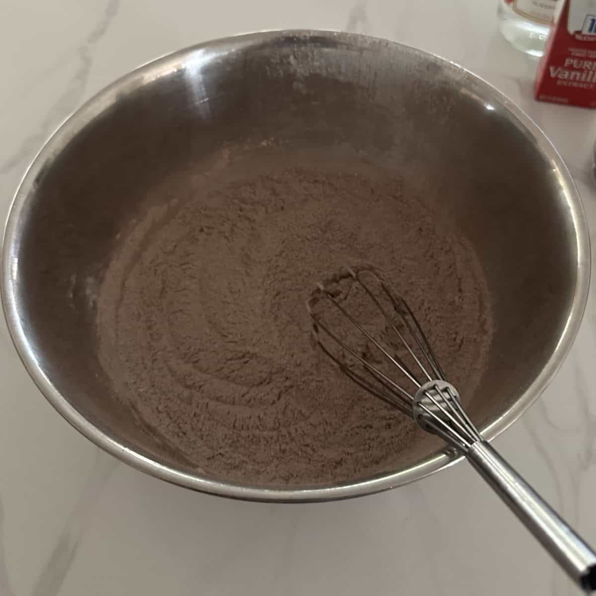 whisk used to whisk the Ap flour and cocoa flour.
