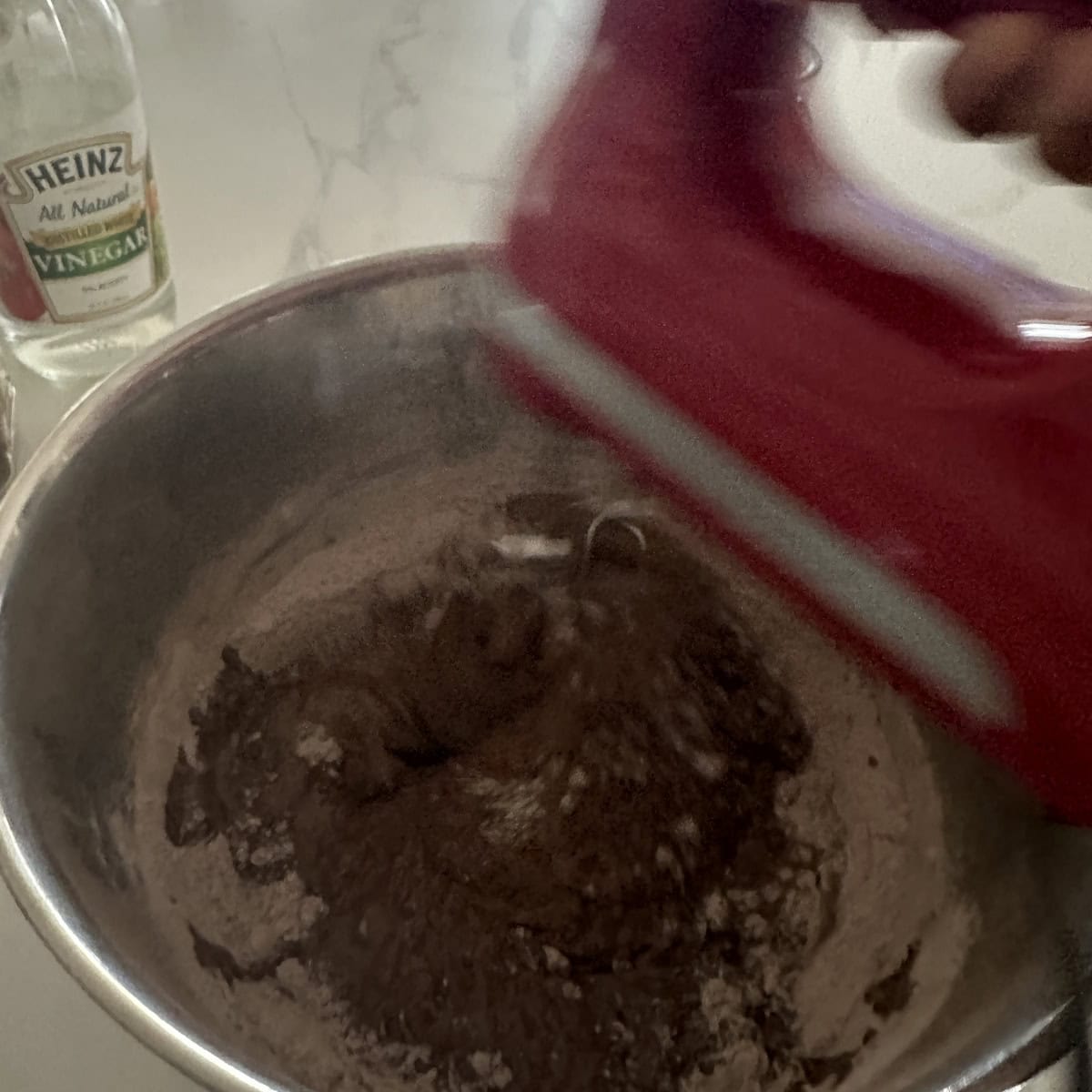 Batter beaten using hand mixer.