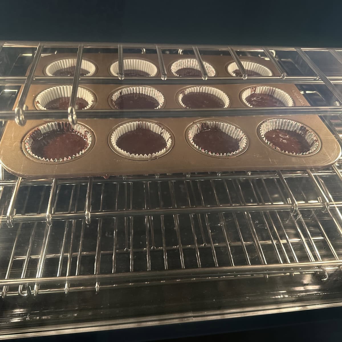 cupcakes being baked in an oven.