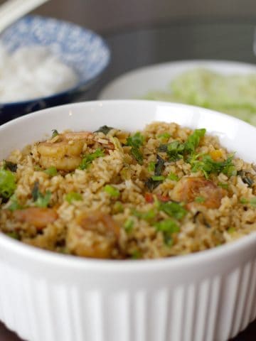 Spicy Thai Shrimp Fried Rice with Basil served in a white casserole.