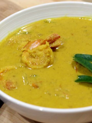 Goan shrimp curry served in a white bowl.