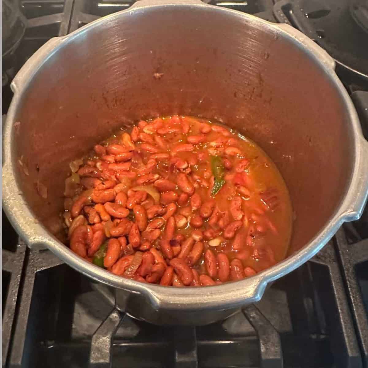 Rajma gravy ready to be cooked in a pressure cooker.