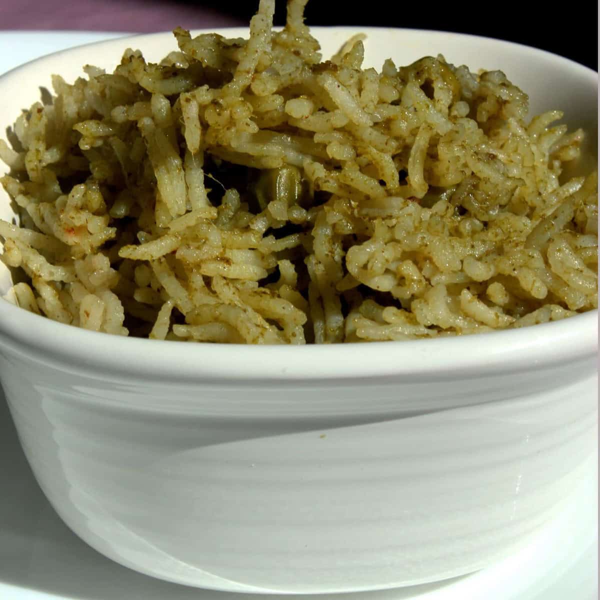 Pudina pulav (Mint Rice) in a white bowl .
