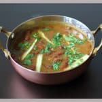 Rajma Gravy served in a copper vessel .