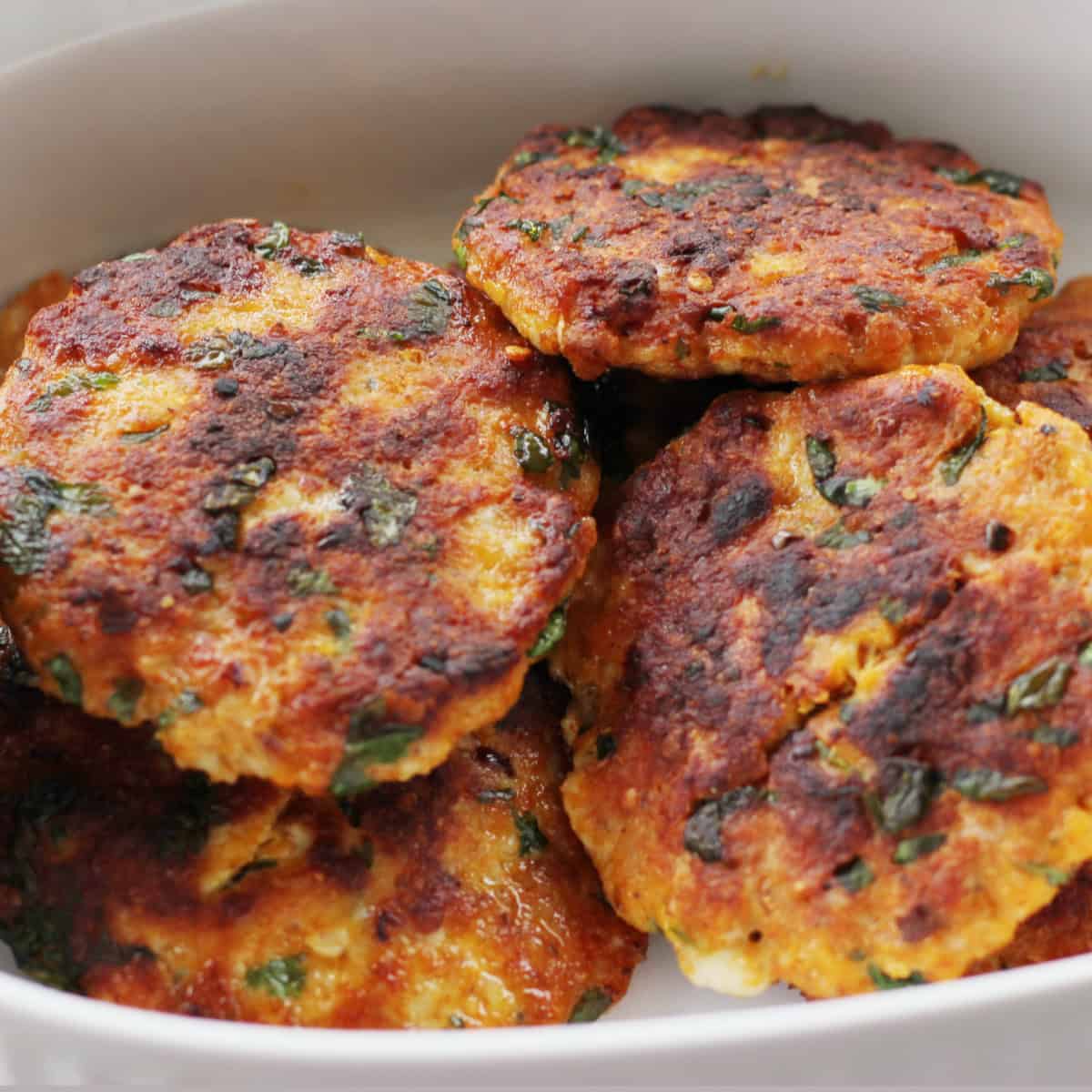 minced chicken patty in a white casserole.