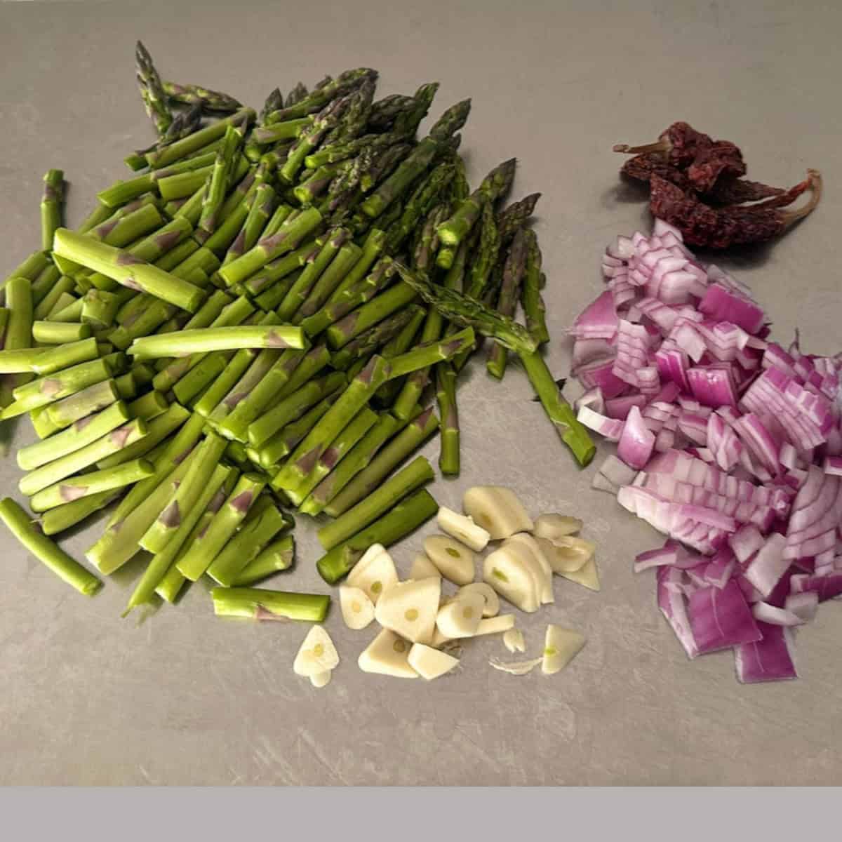 veggies chopped to make asparagus stir fry.