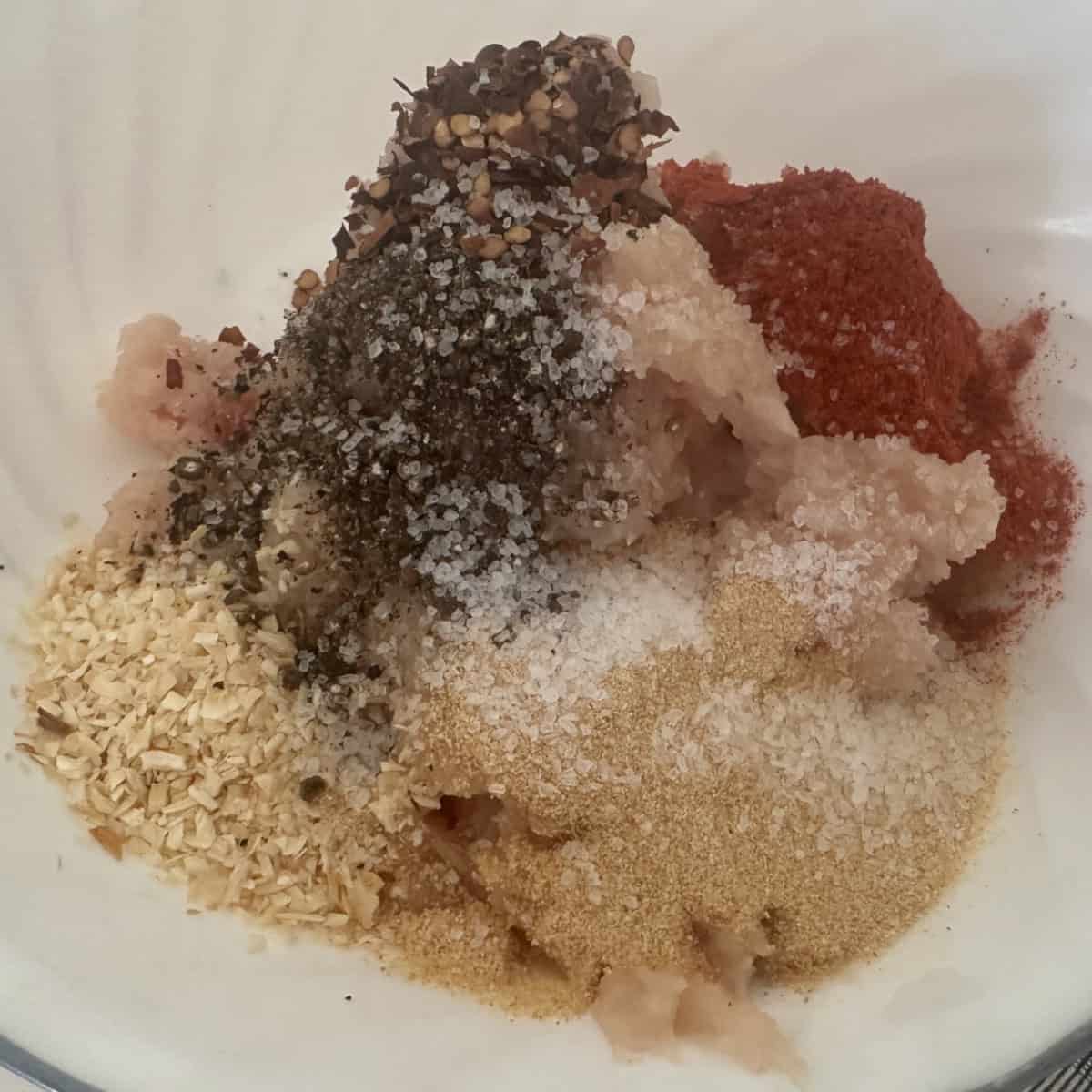 Add spices to the minced chicken.