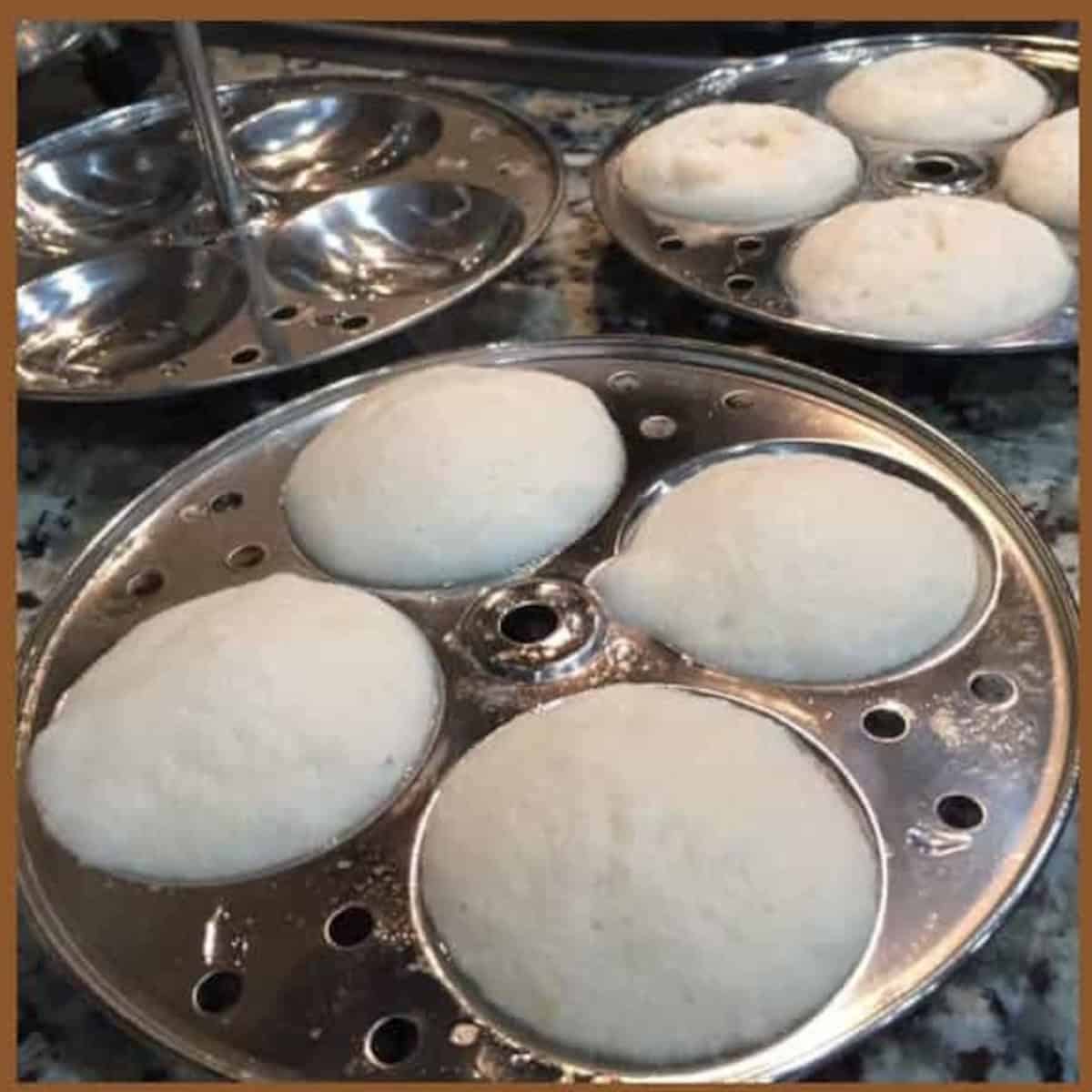 soft idli steamed in idli steamer.
