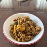 Mathanga Errisery in a white bowl.