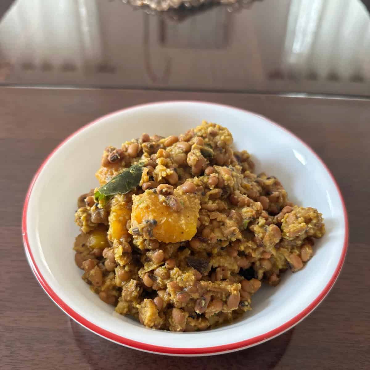 Mathanga Errisery in a white bowl.