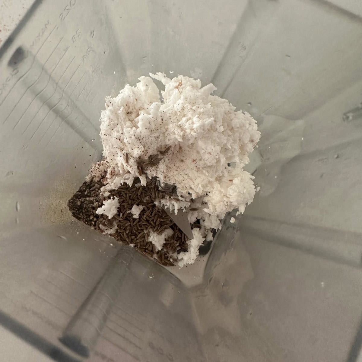grated coocnut, cumin and pepper in a mixer.