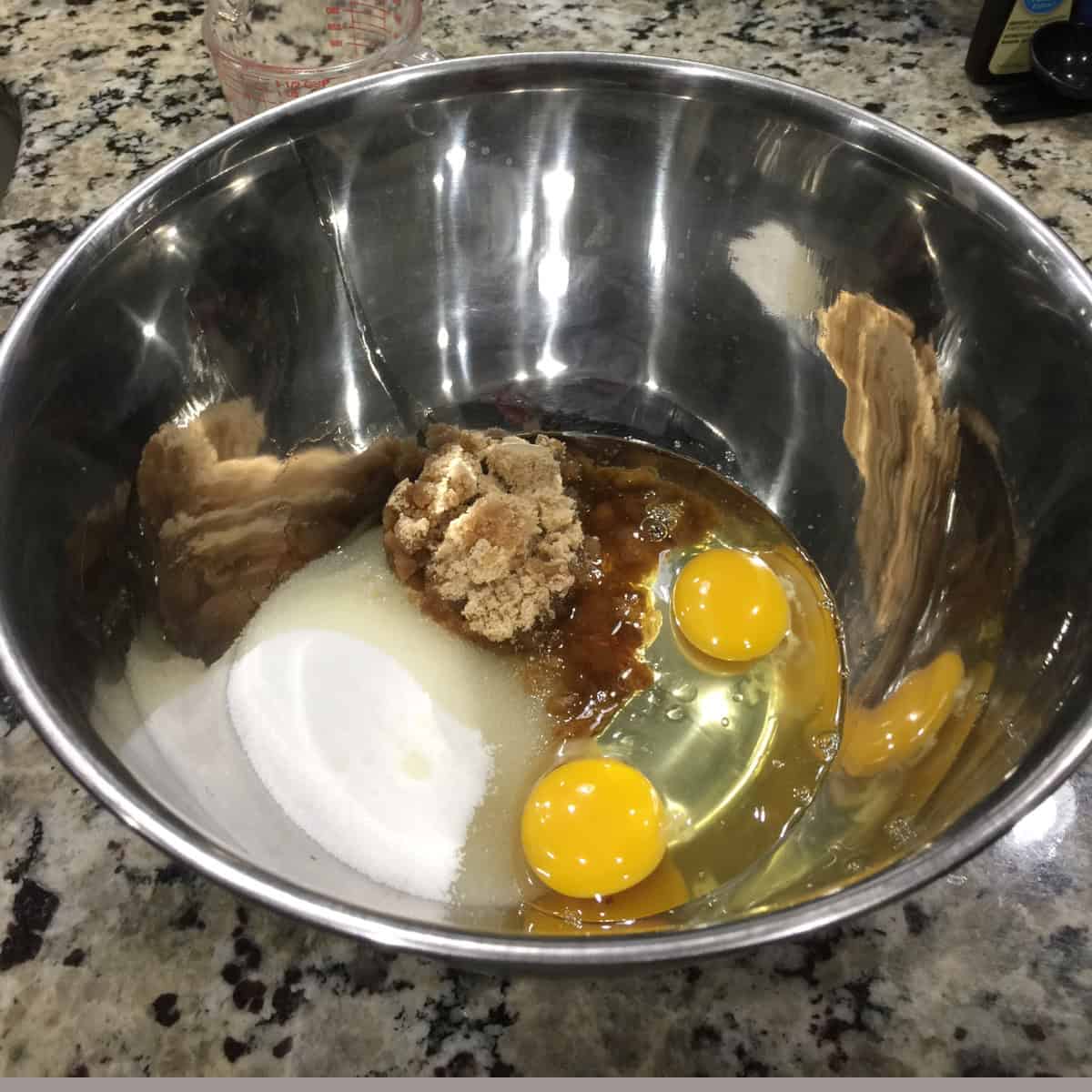 wet ingredients to make chocolate cupcakes in a steel bowl.