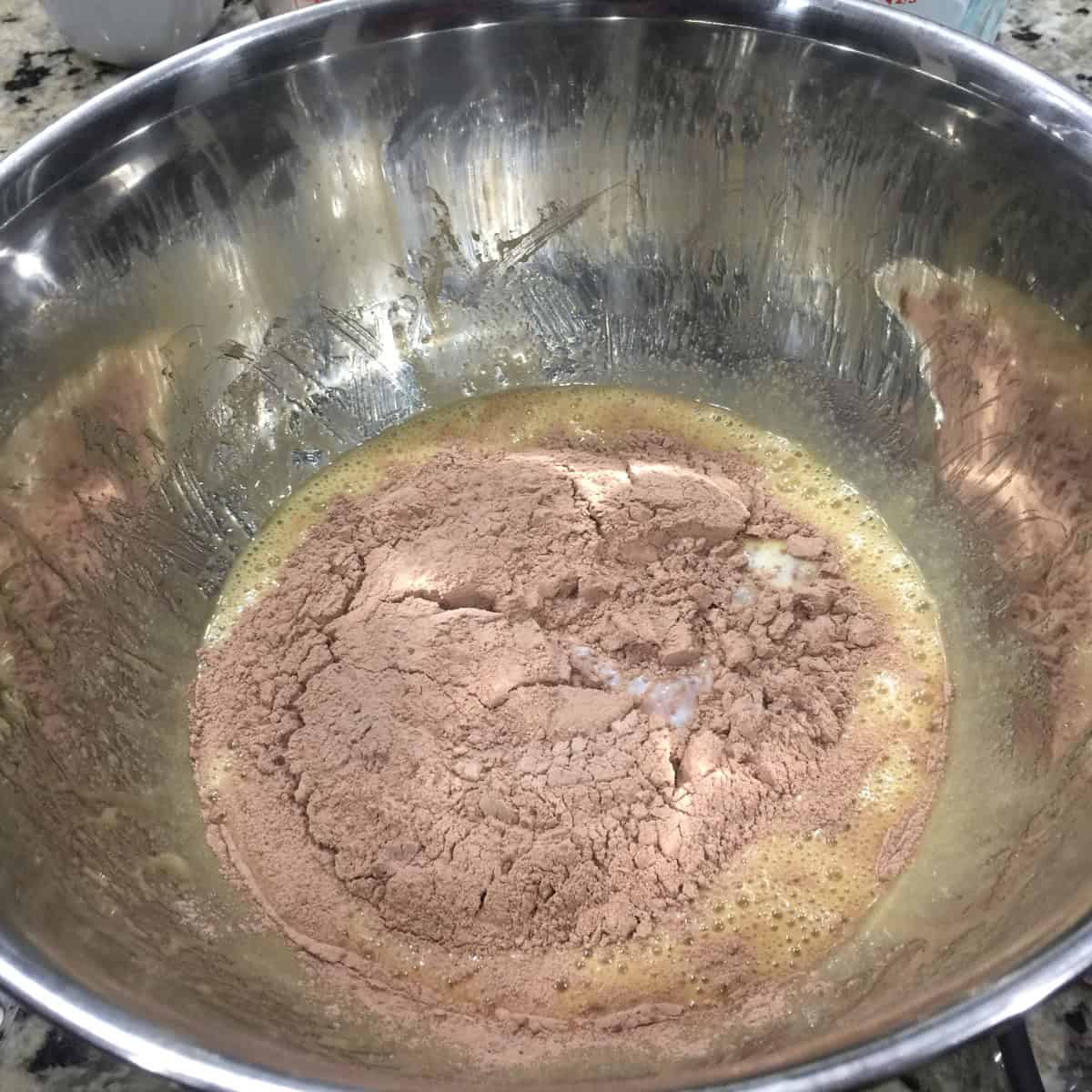 cocoa powder added to make chocolate cupcake batter.