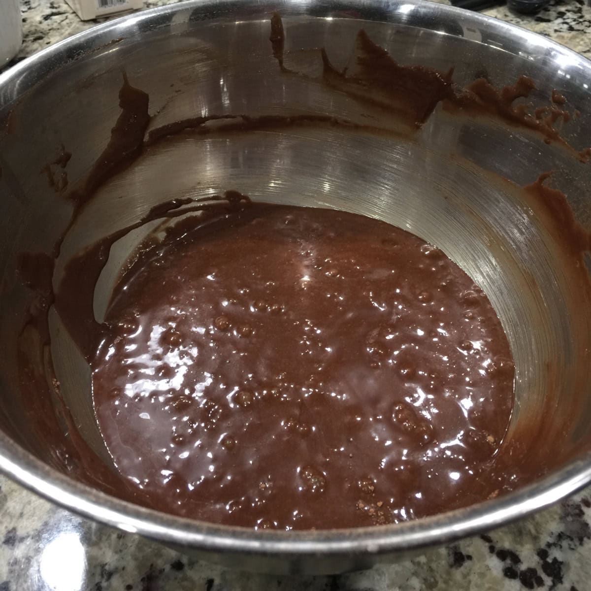 chocolate cupcake batter in a steel bowl.