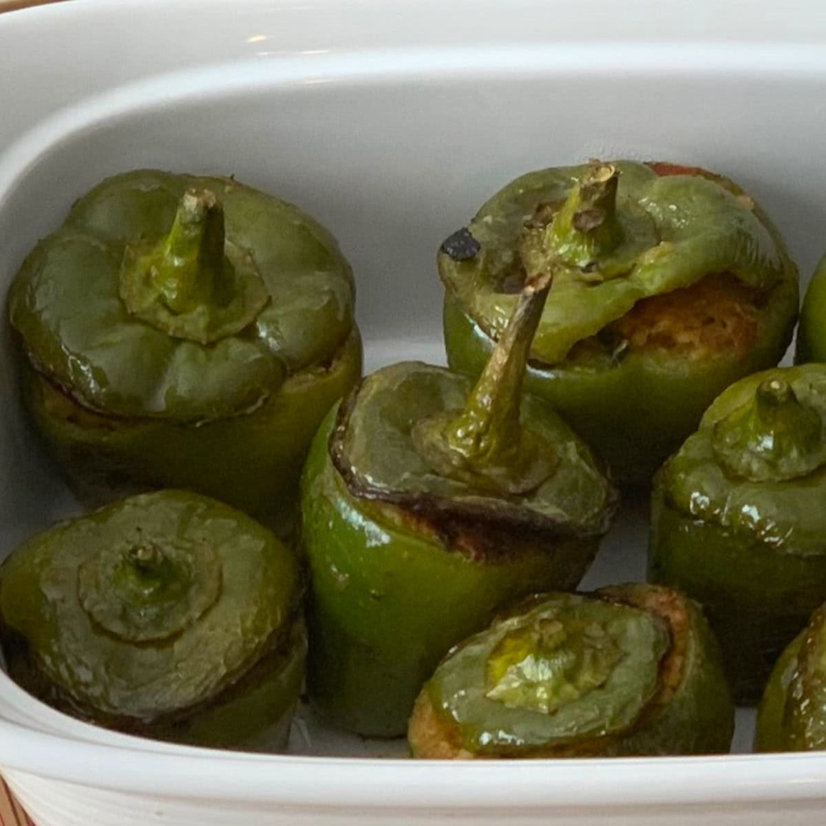 stuffed bell pepper served in a white casserole.