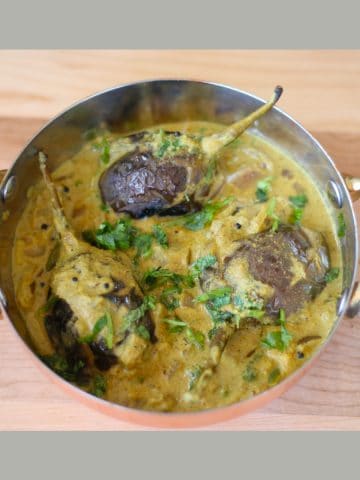Bagara Baingan made with Bagara baingan recipe served in a copper vessel.