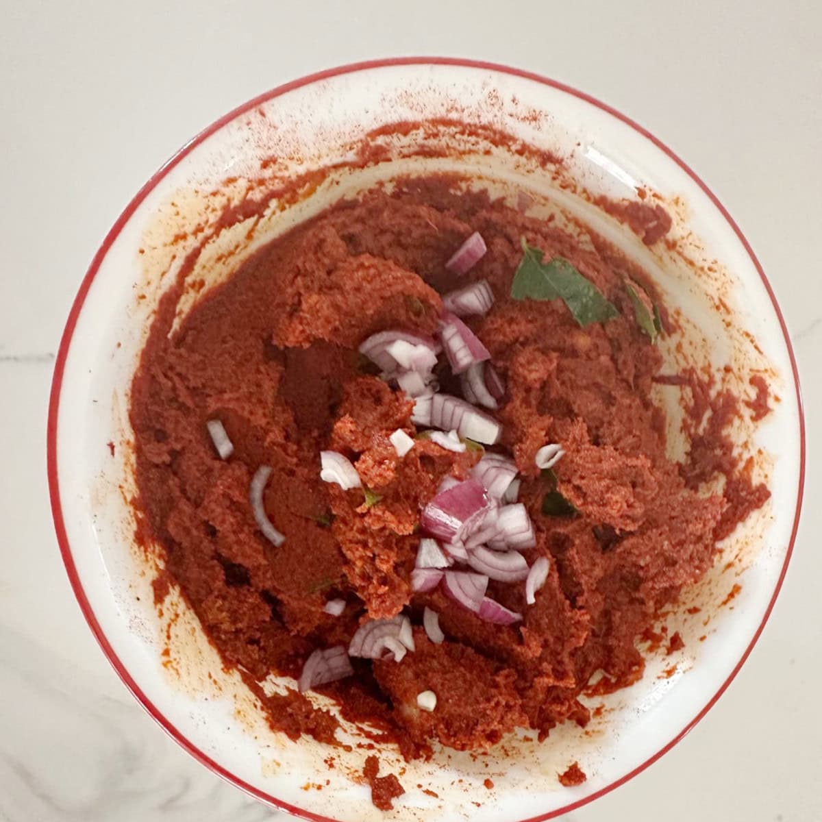 Marinade for pan-fried Tilapia mixed in a white bowl.