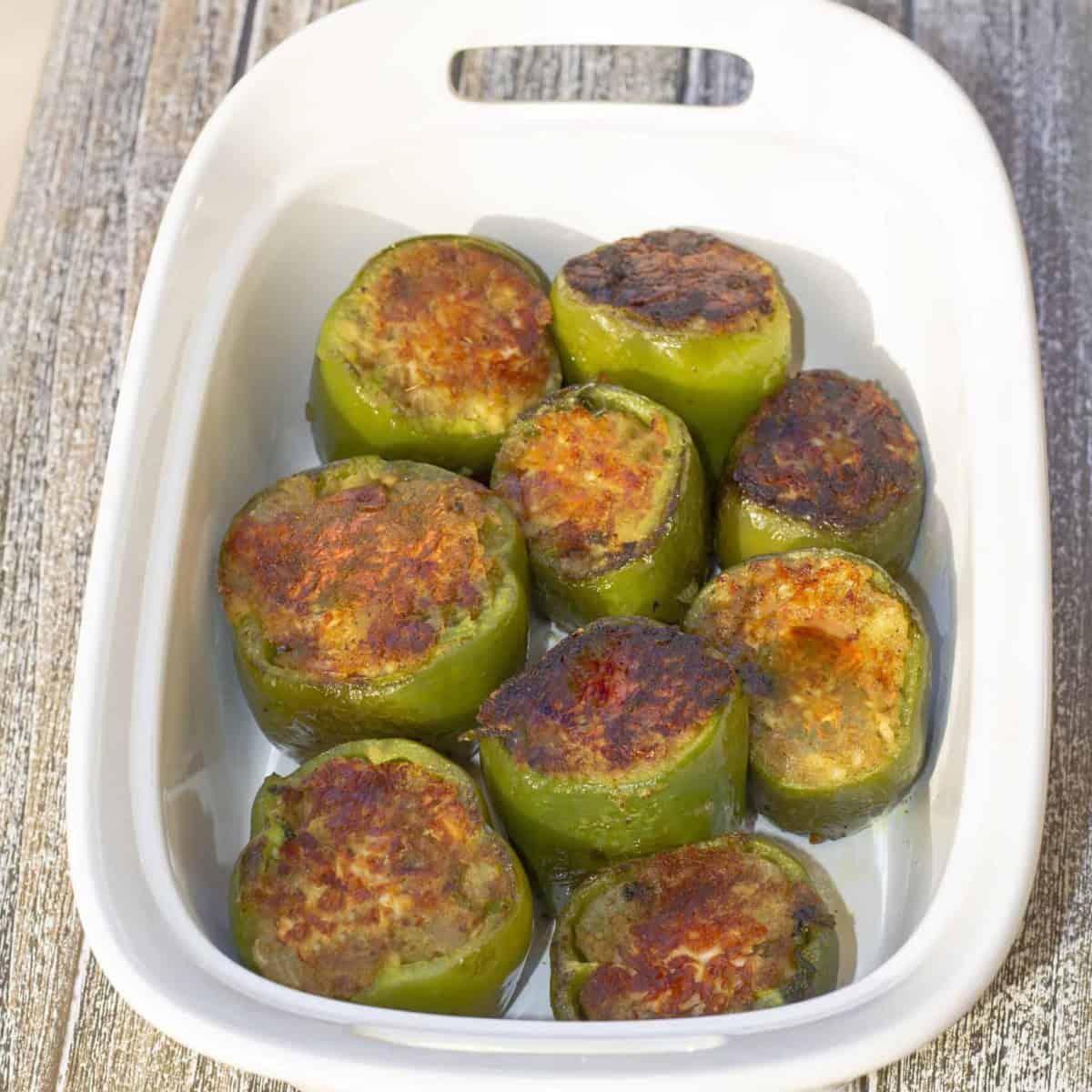 bharwa shimla mirch in a white casserole.