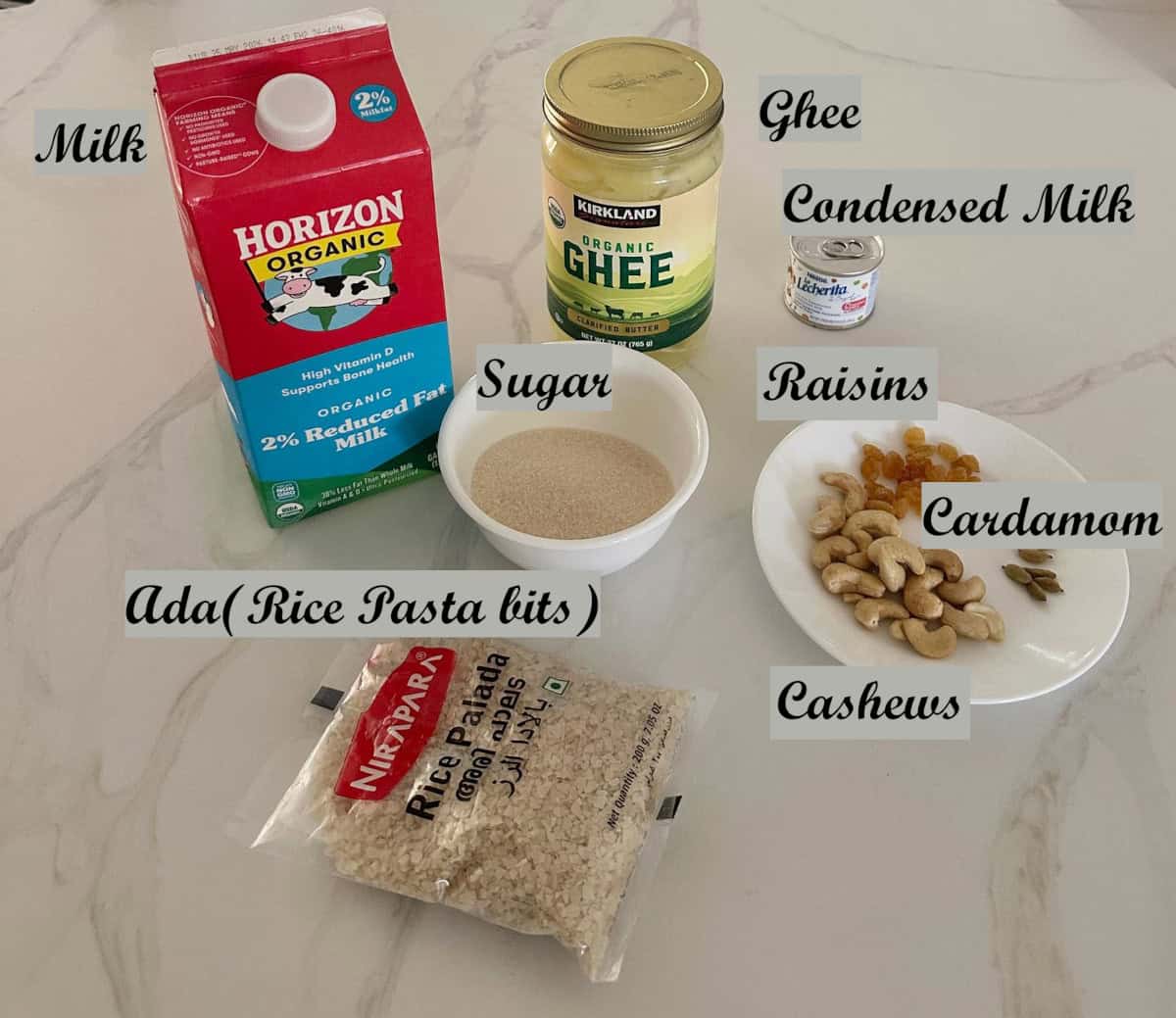 ingredients to make palada payasam on a white counter.