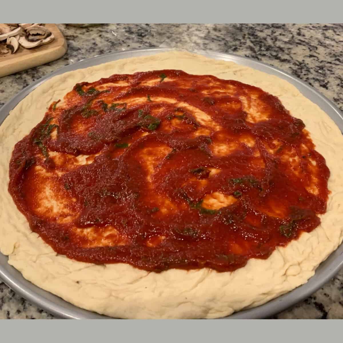 pizza sauce on pizza crust.