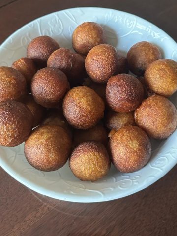 Unniappam made with unniappam recipe that is instant, soft and no -fail served in a white bowl.