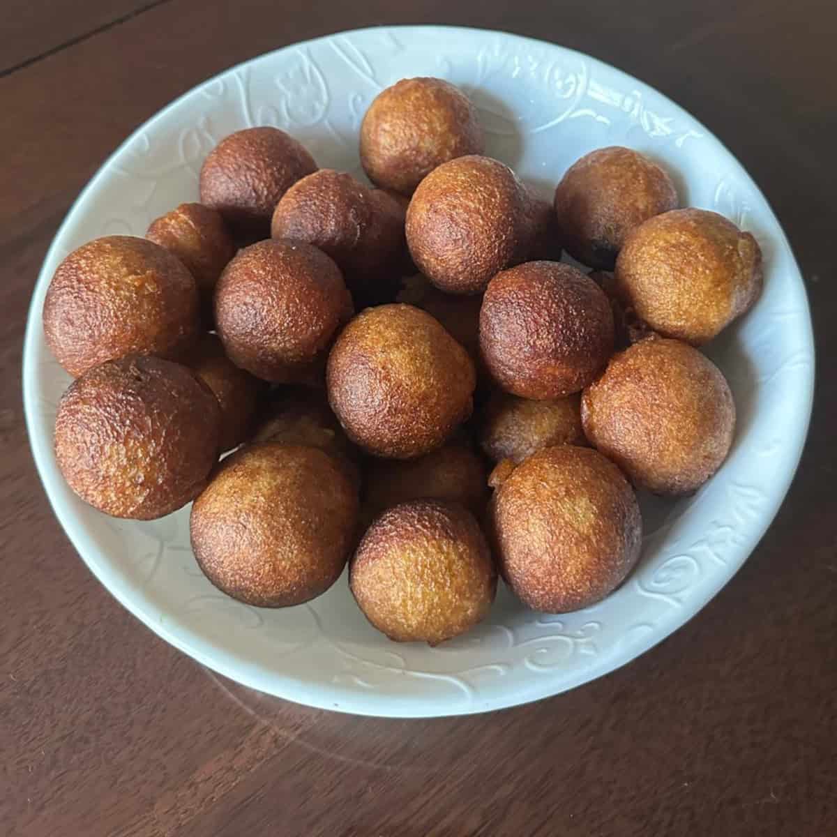 Unniappam made with unniappam recipe that is instant, soft and no -fail served in a white bowl.