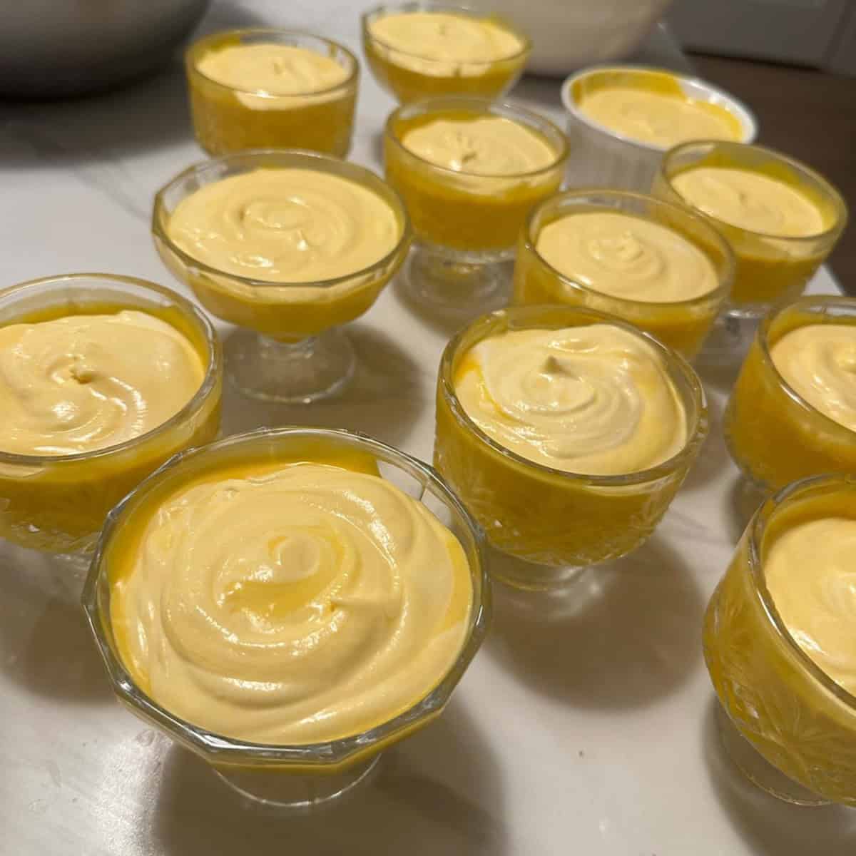 manago mousse dessert being served in small dessert cups.