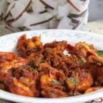 chemmeen roast or Kerala Prawn Roast served in a white plate.