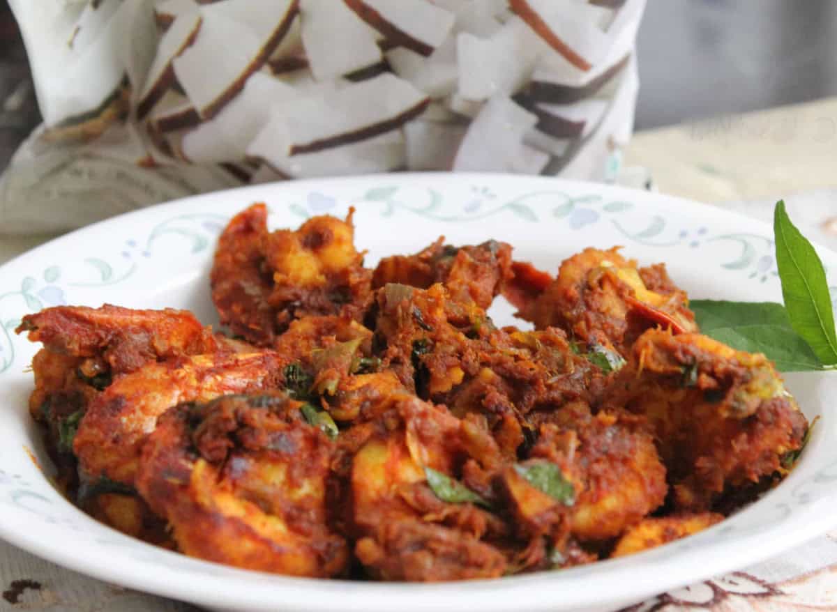 chemmeen roast or Kerala Prawn Roast served in a white plate.