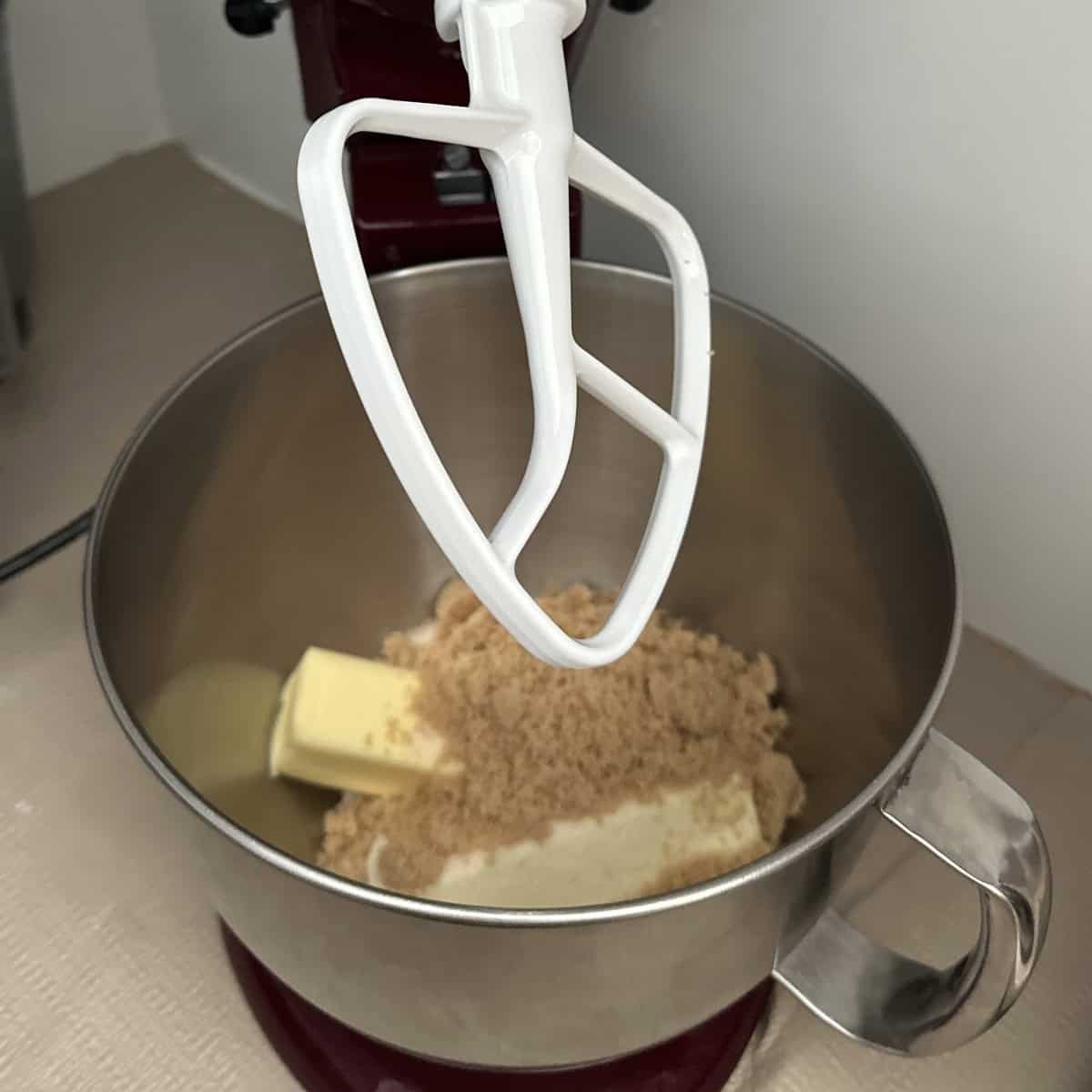 coconut sugar, butter and coconut oil being creamed in a stand mixer.