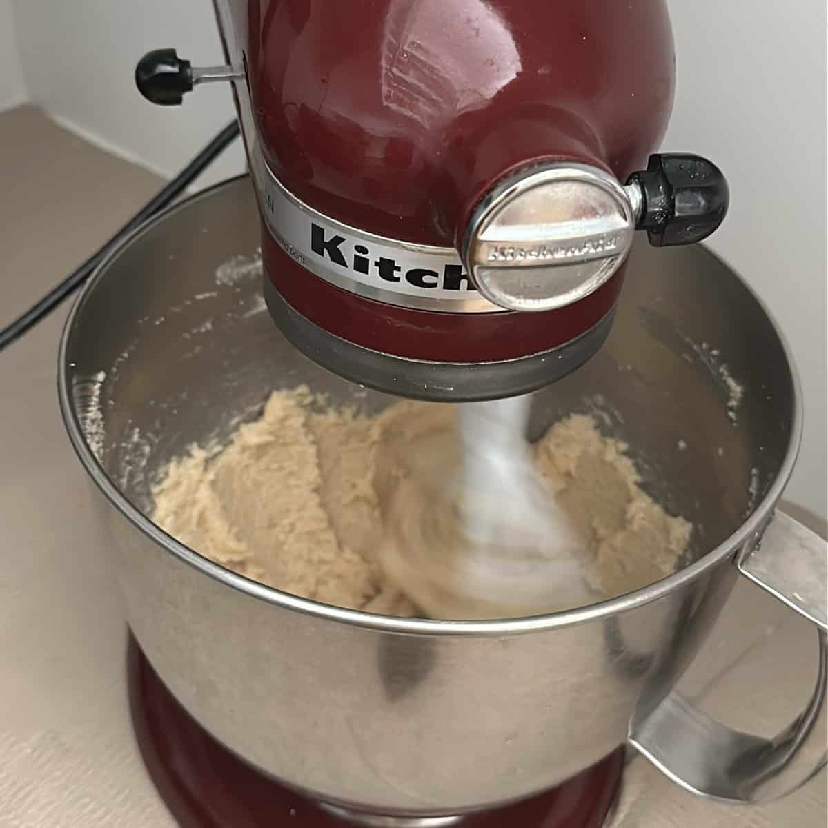 coconut sugar, butter and coconut oil being creamed in a stand mixer.