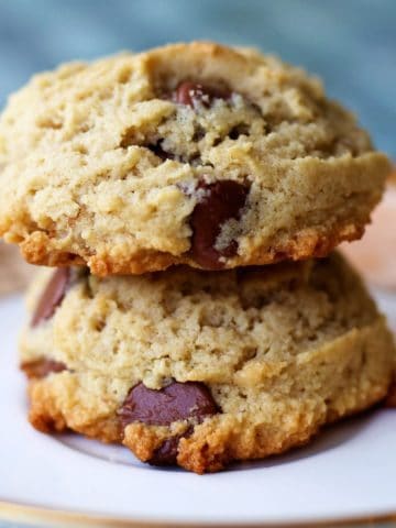 Almond flour chocolate chip cookies served on a white plate.