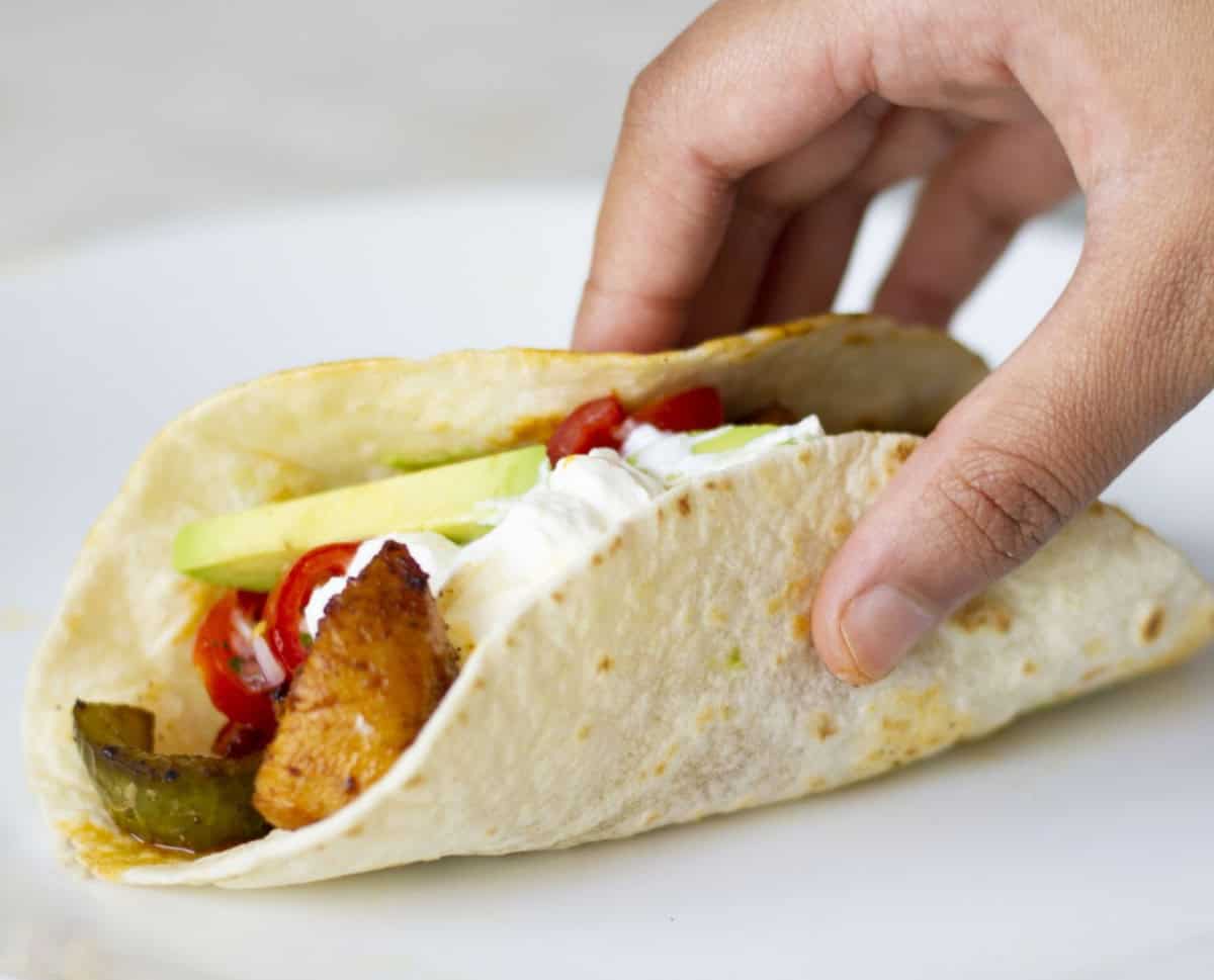 homemade fajitas being picked up.