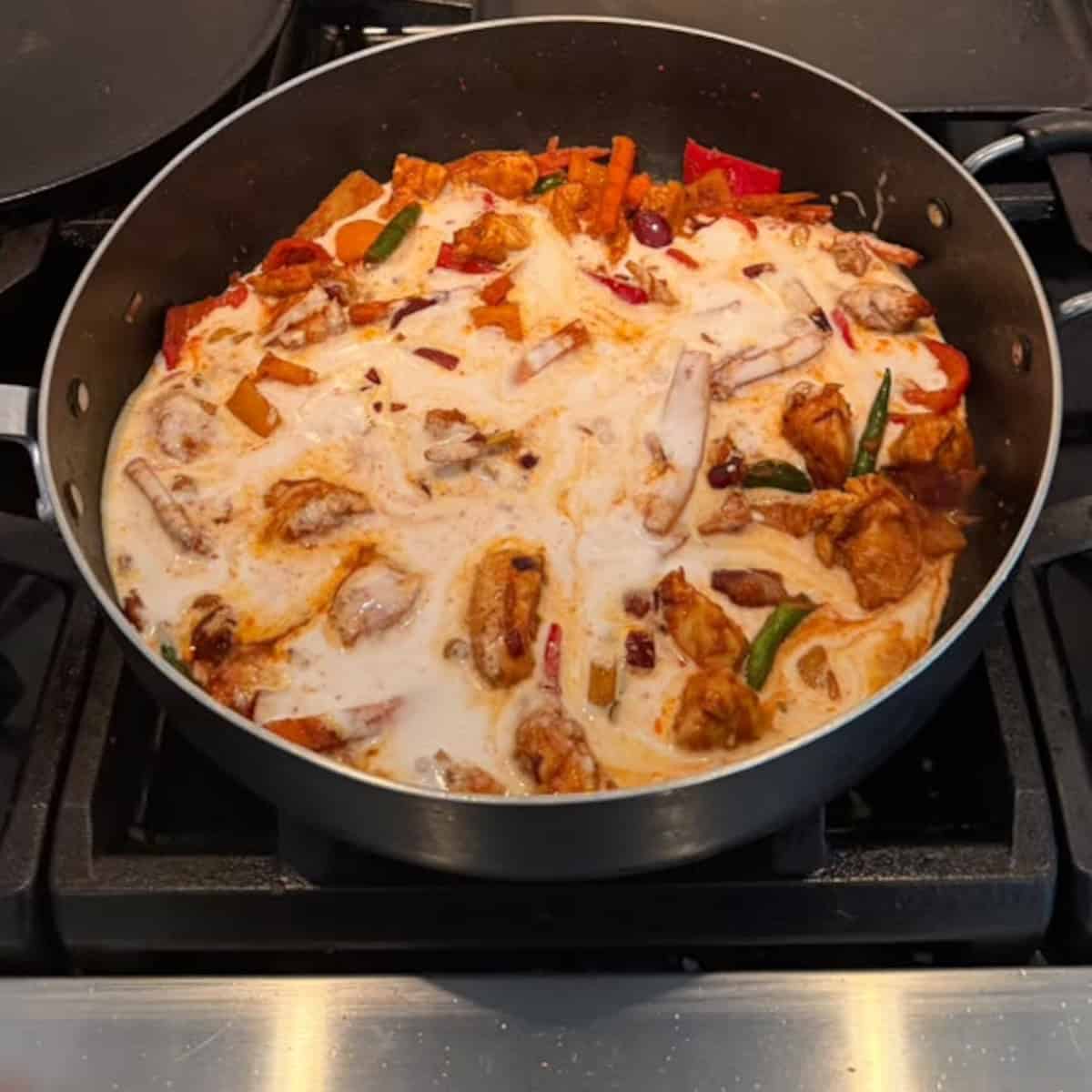 coconut milk added to red thai curry.