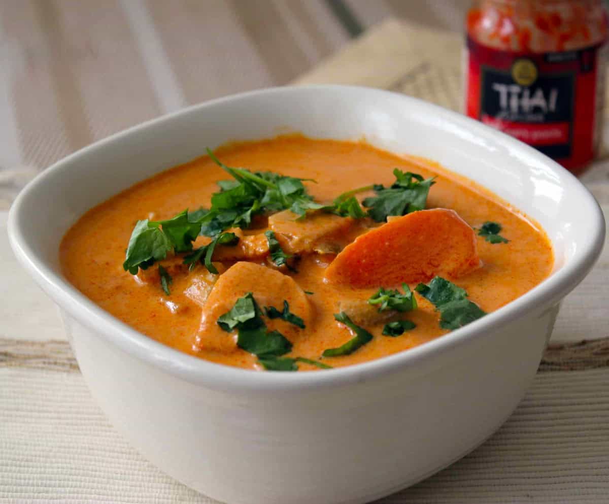 Thai red curry made with Thai red curry chicken recipe served in a white bowl.